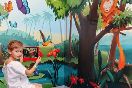 A child engaging with AR technology in a pediatric healthcare environment.